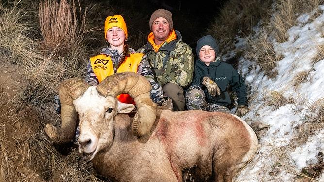 Kiersten Black is joined by father and brother after her successful hunt.